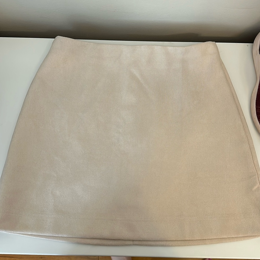Tan suede mini skirt.